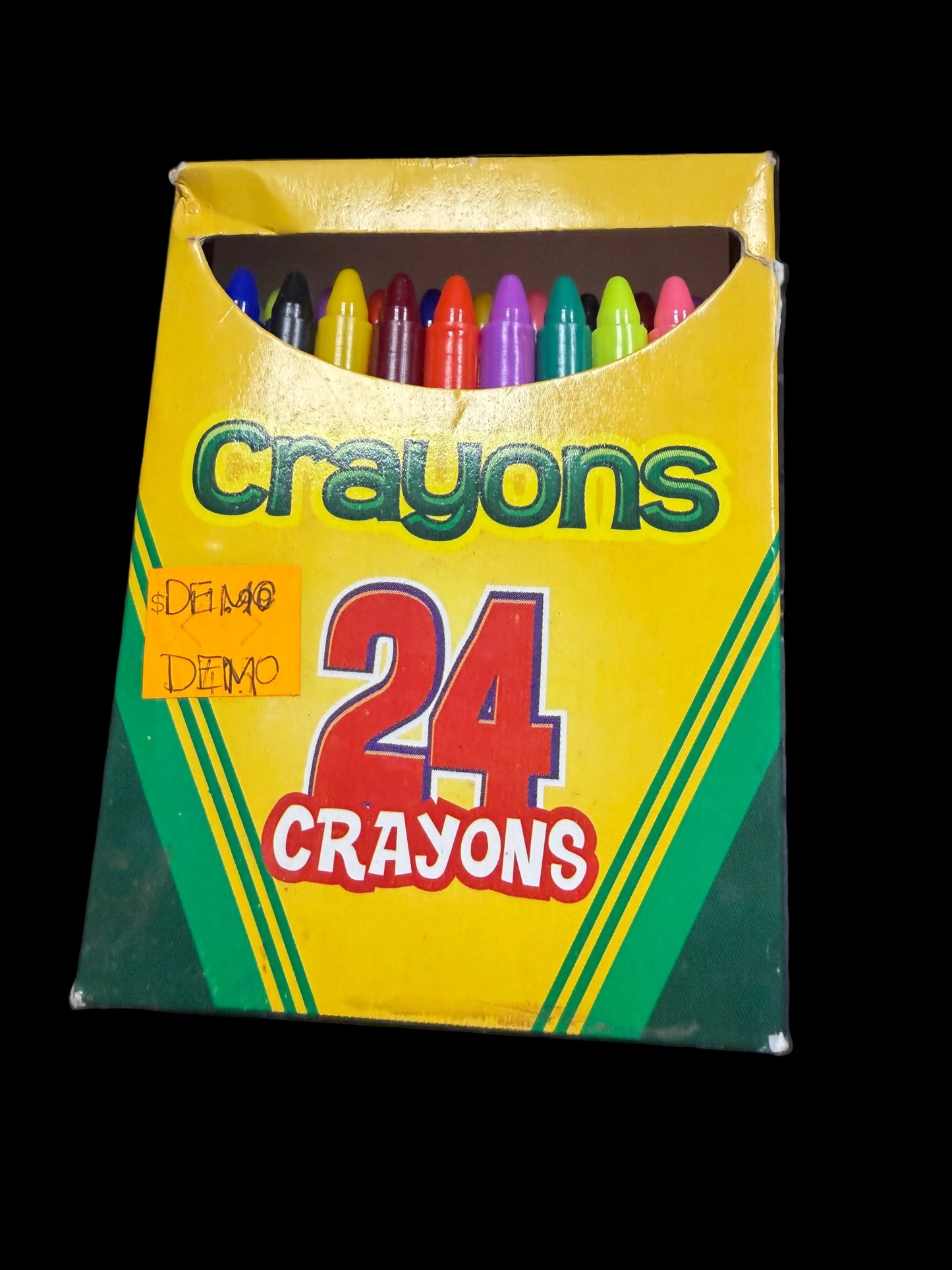 Box of Crayola crayons on a dark textured surface
