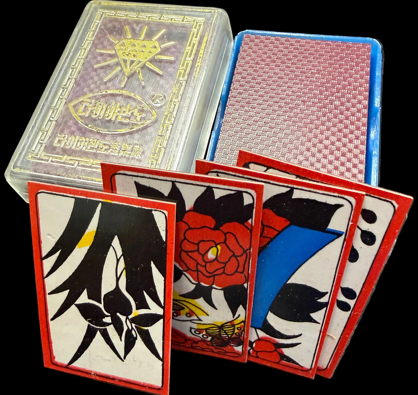 Playing cards with artistic designs on a textured surface