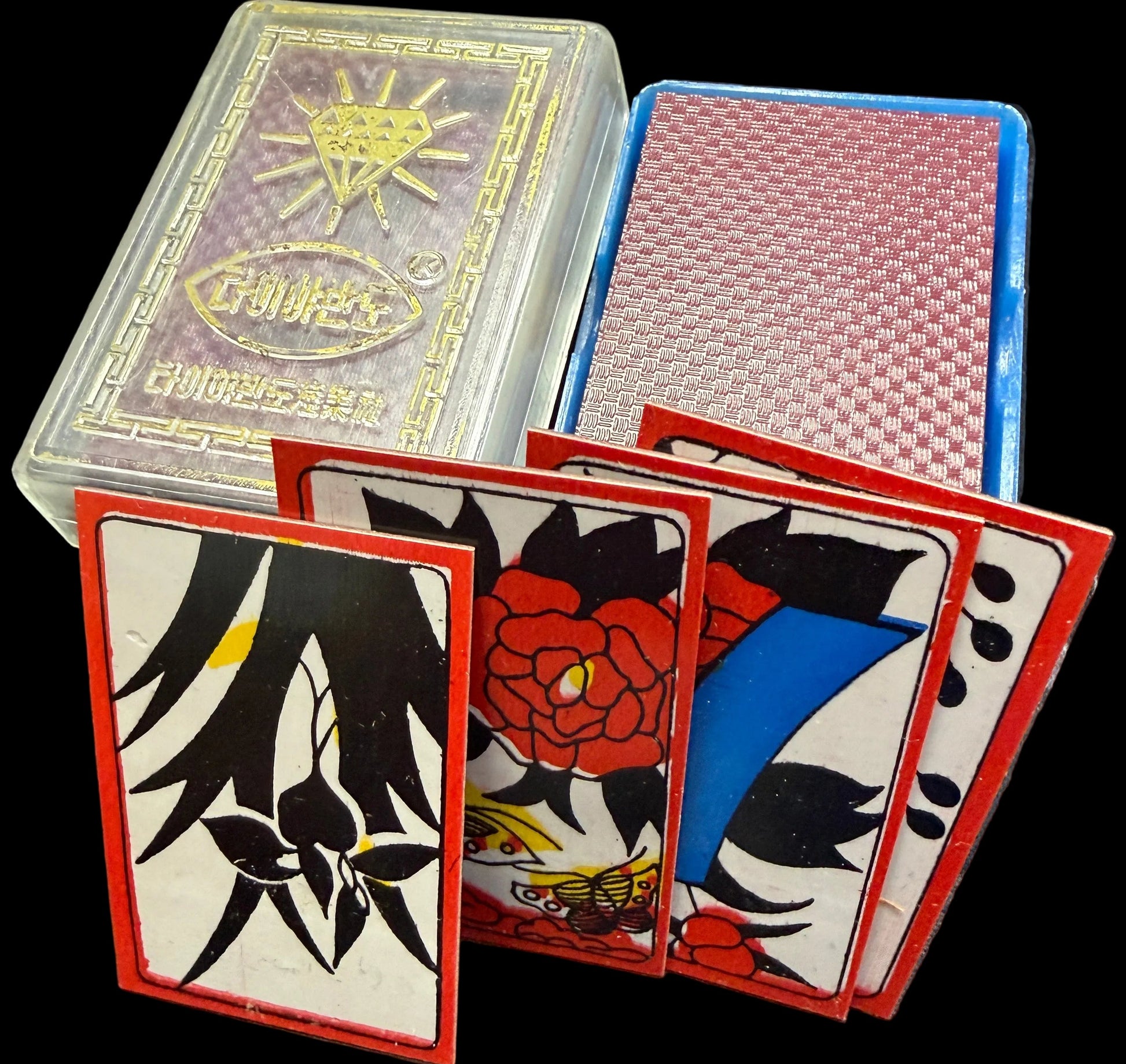 Playing cards with artistic designs on a textured surface