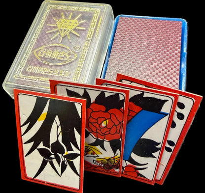 Playing cards with artistic designs on a textured surface