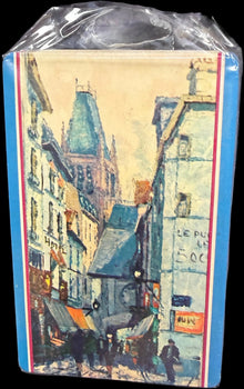 Small book or notebook with a colorful cover on a map background