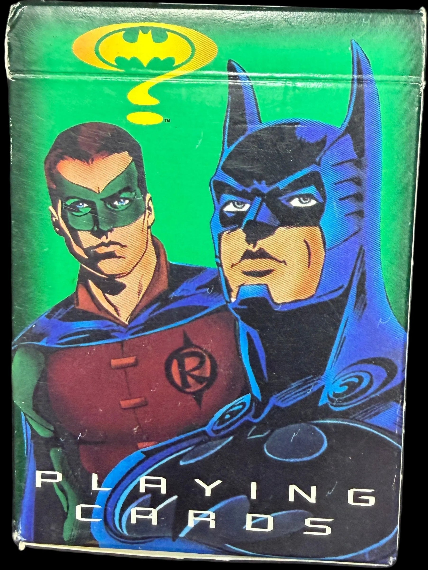 Batman and Robin playing cards packaging with a green background