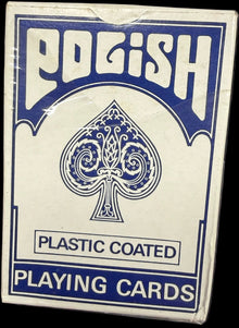 Pack of playing cards with blue and white design on a dark background