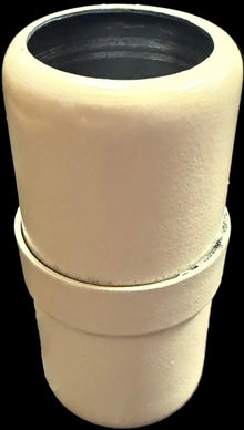Stack of white ceramic pots with a black interior on a white background