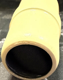 Yellow cardboard tube on a world map