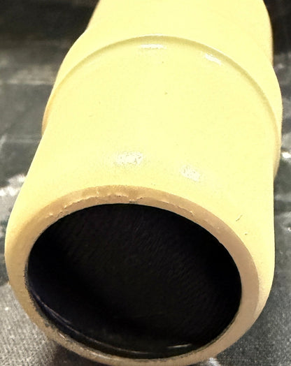 Yellow cardboard tube on a world map