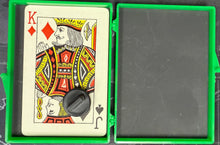 Playing card with a decorative design in a green holder on a map background
