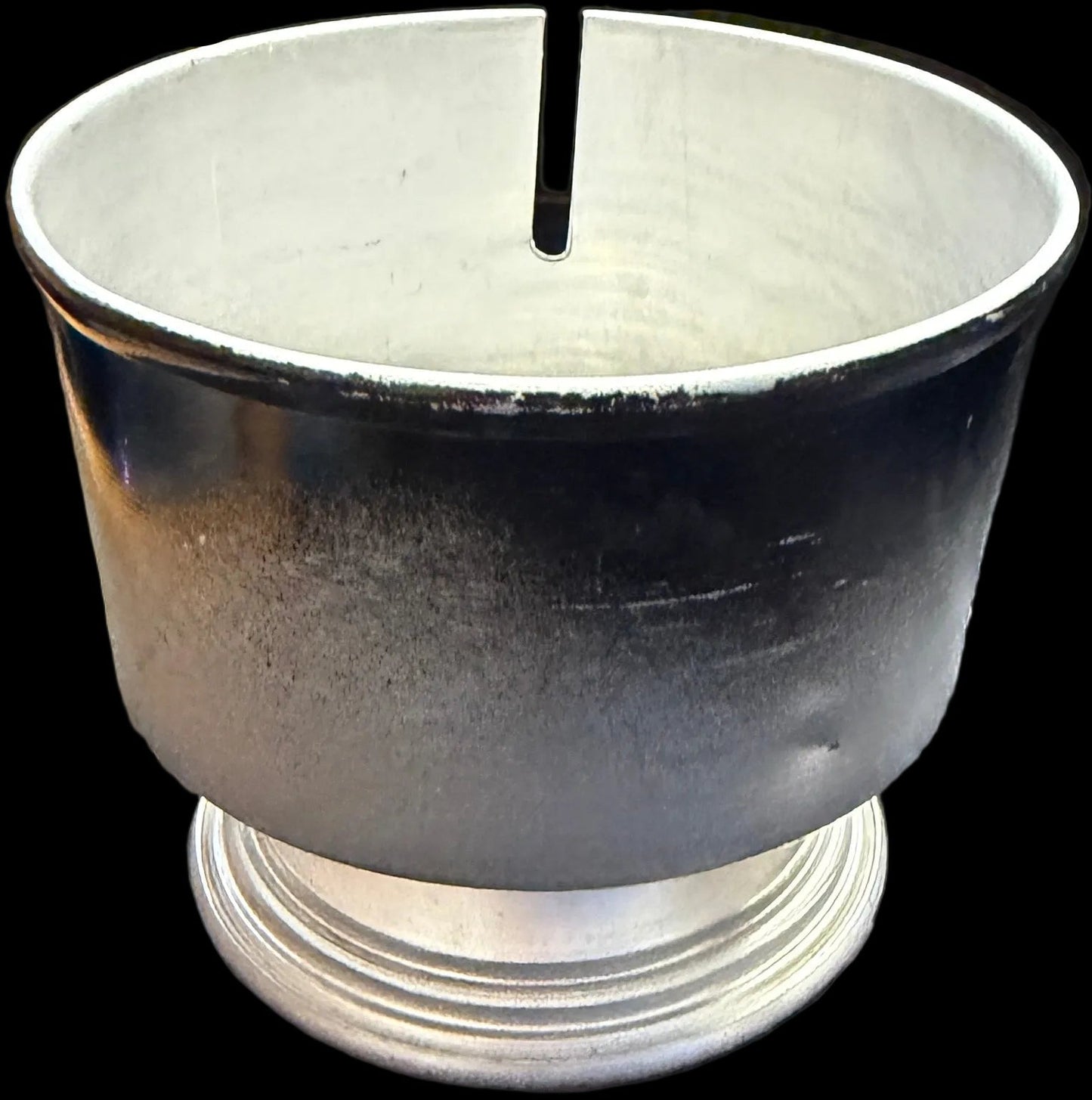 Candle in a black holder on a white background