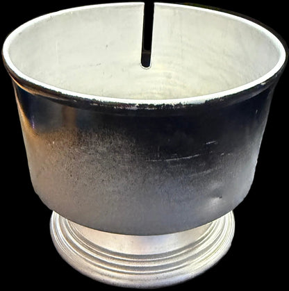 Candle in a black holder on a white background