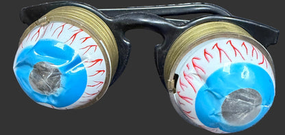 Two fishing reel spools with blue and red line on a map background