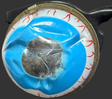 Small blue and white object on a textured surface