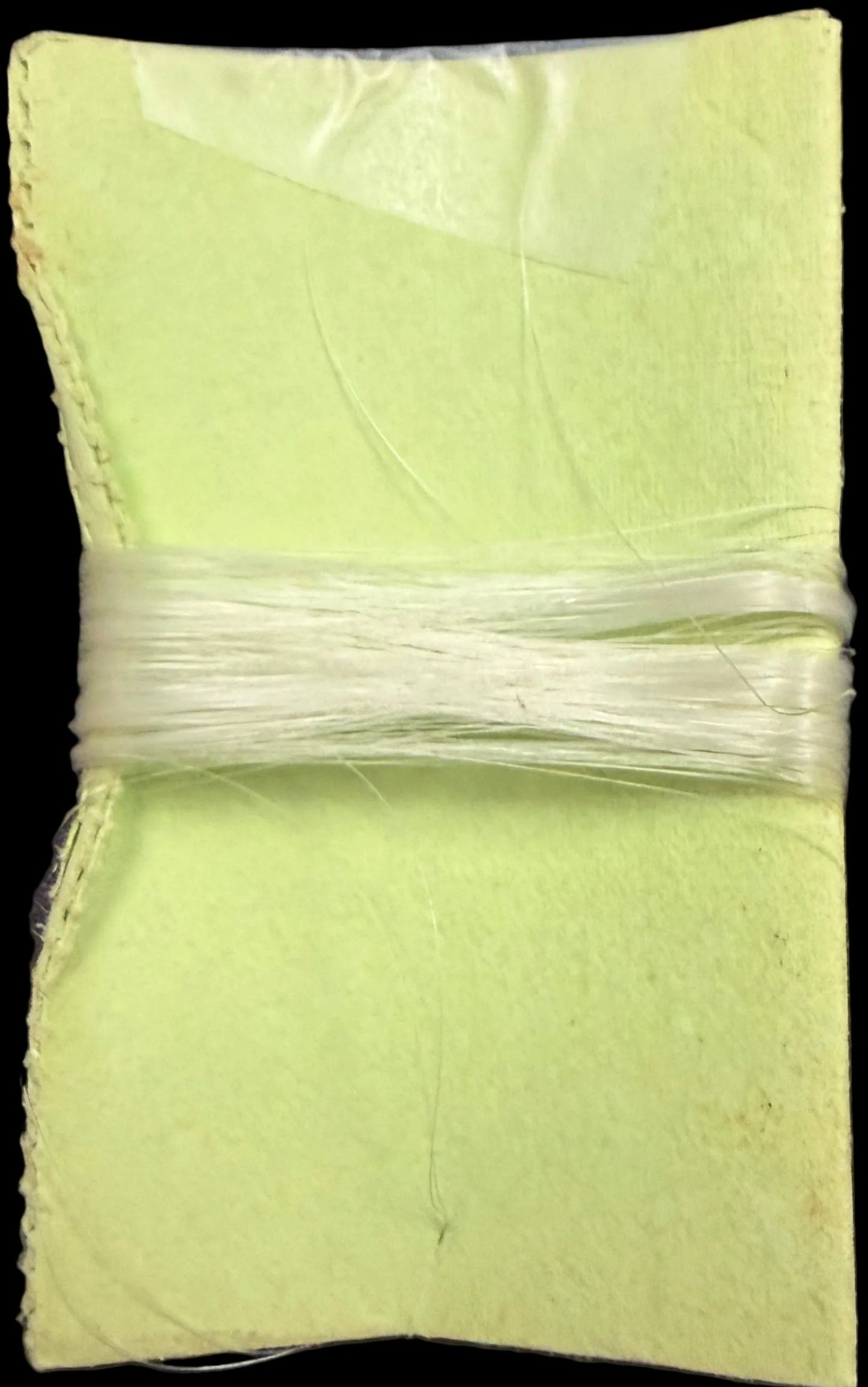 Green fabric square on a map background