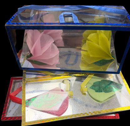 Decorative greeting cards with floral designs in a clear plastic sleeve.