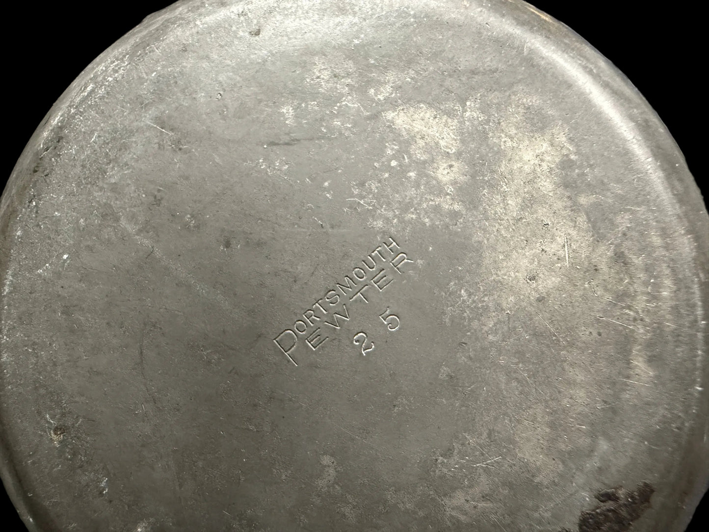 Metal container with 'Dorothy Day' branding on a blurred background