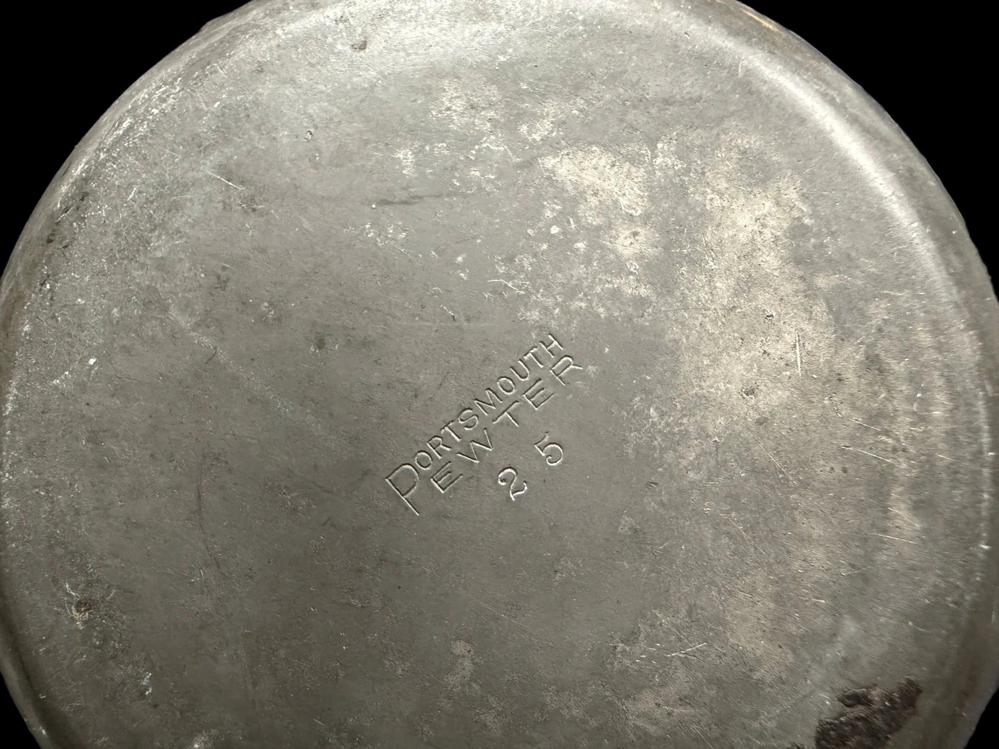 Metal container with 'Dorothy Day' branding on a blurred background