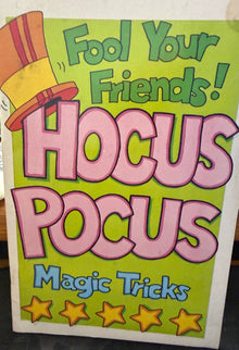 Hocus Pocus magic tricks book with colorful text and stars on a green background.