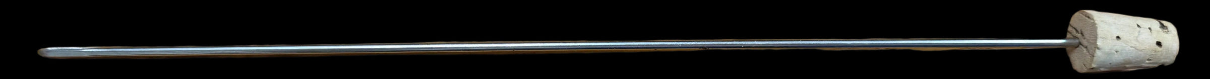 Metal rod with a cork stopper on a wooden surface