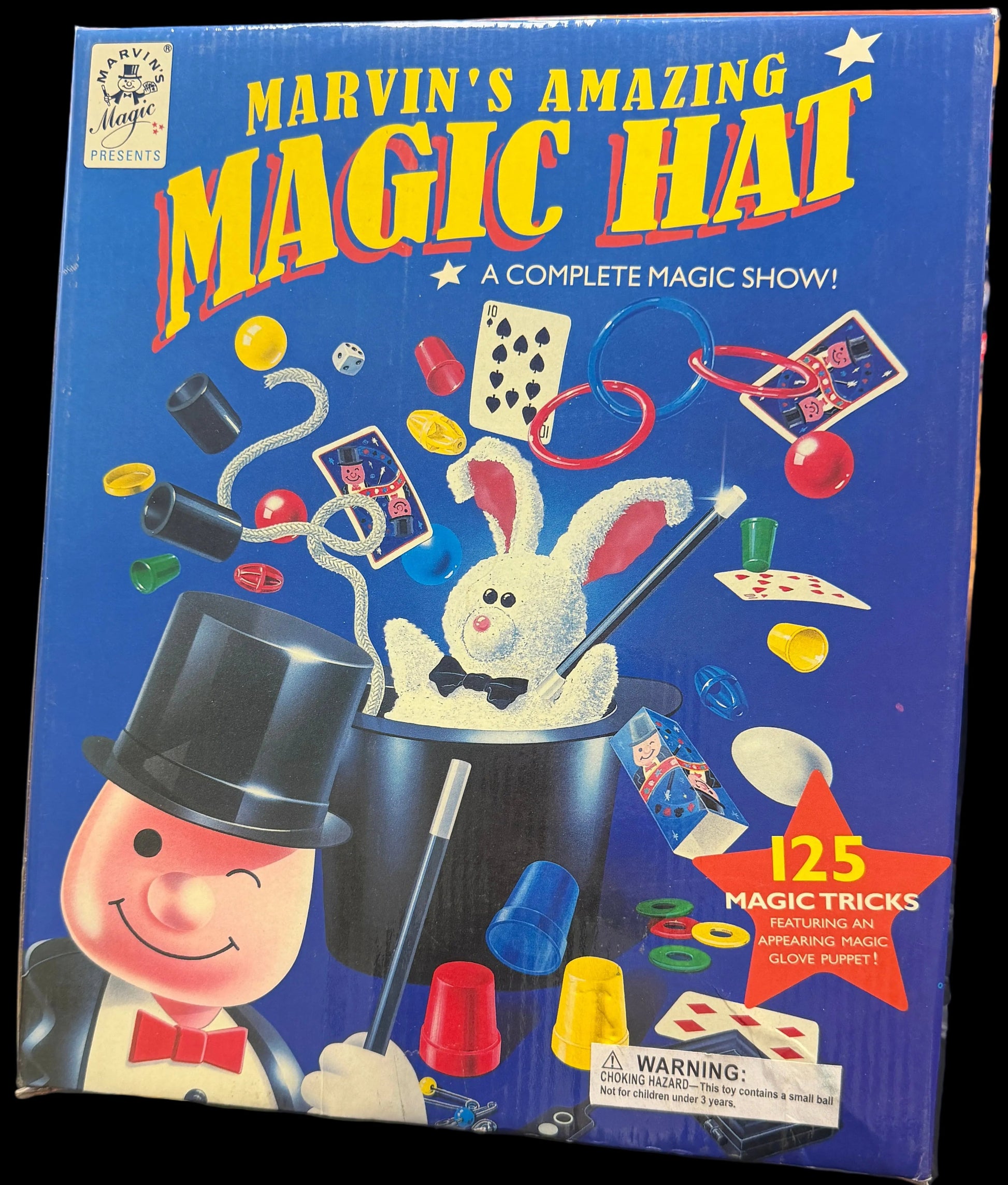 Marvin's Amazing Magic Hat box on a table with electronic equipment in the background