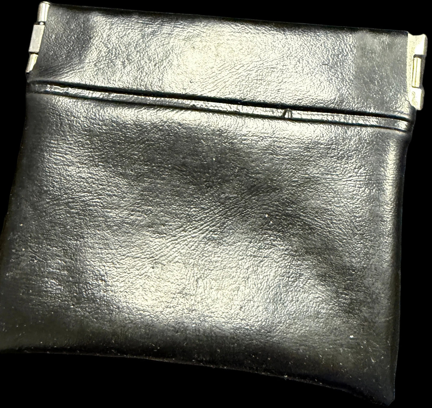 Black leather wallet on a map background