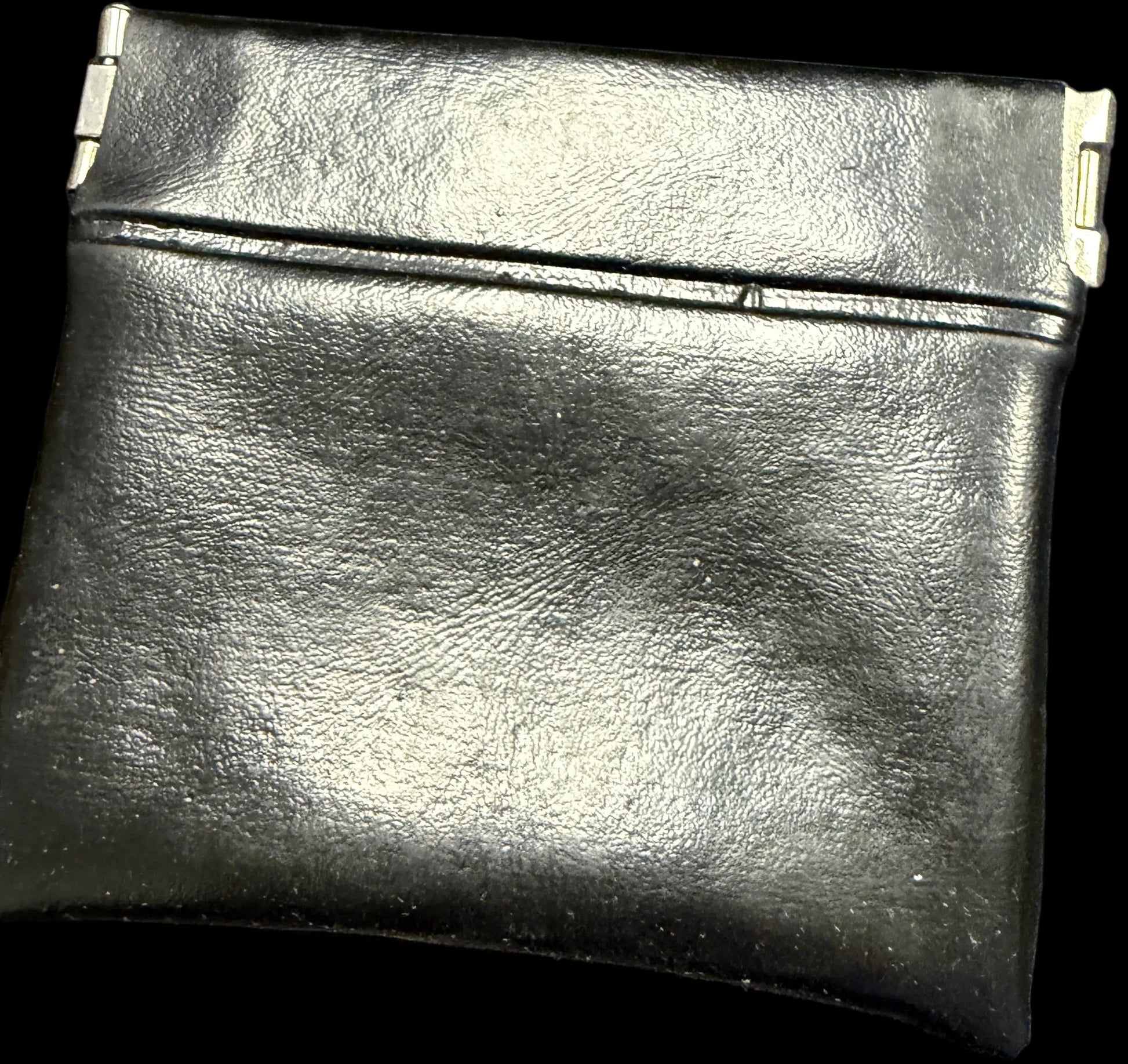 Black leather wallet on a map background