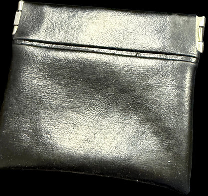 Black leather wallet on a map background