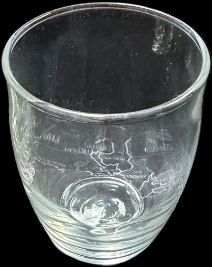 Two clear glasses on a map of Russia