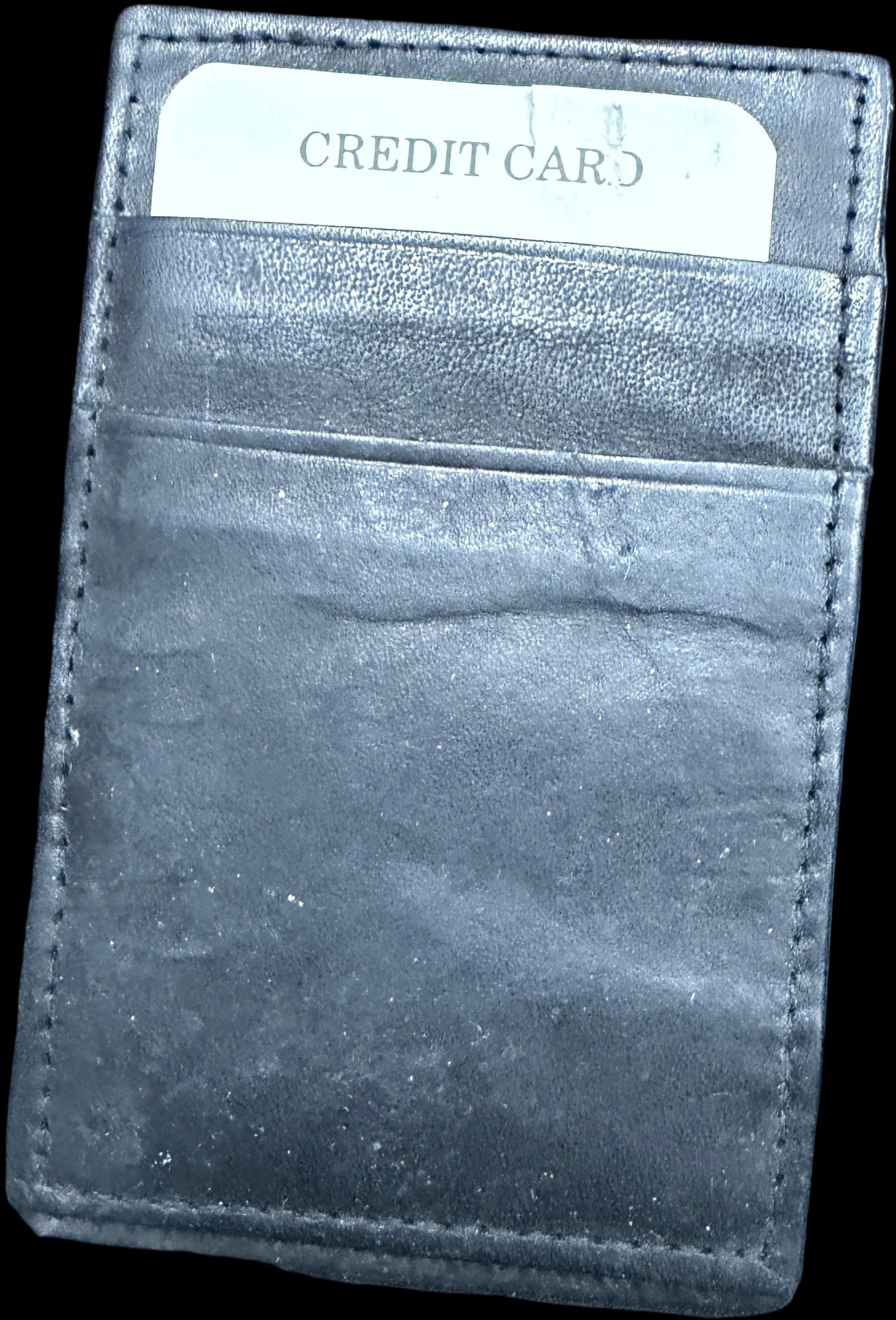 Black leather wallet with a card holder on a world map background