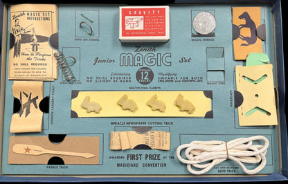 Collection of vintage items including a matchbox, Chinese laundry ticket, and a small box with a label on a blue background.