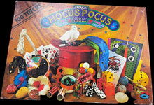 Vintage 'Magic Show' book with colorful illustrations on a desk.