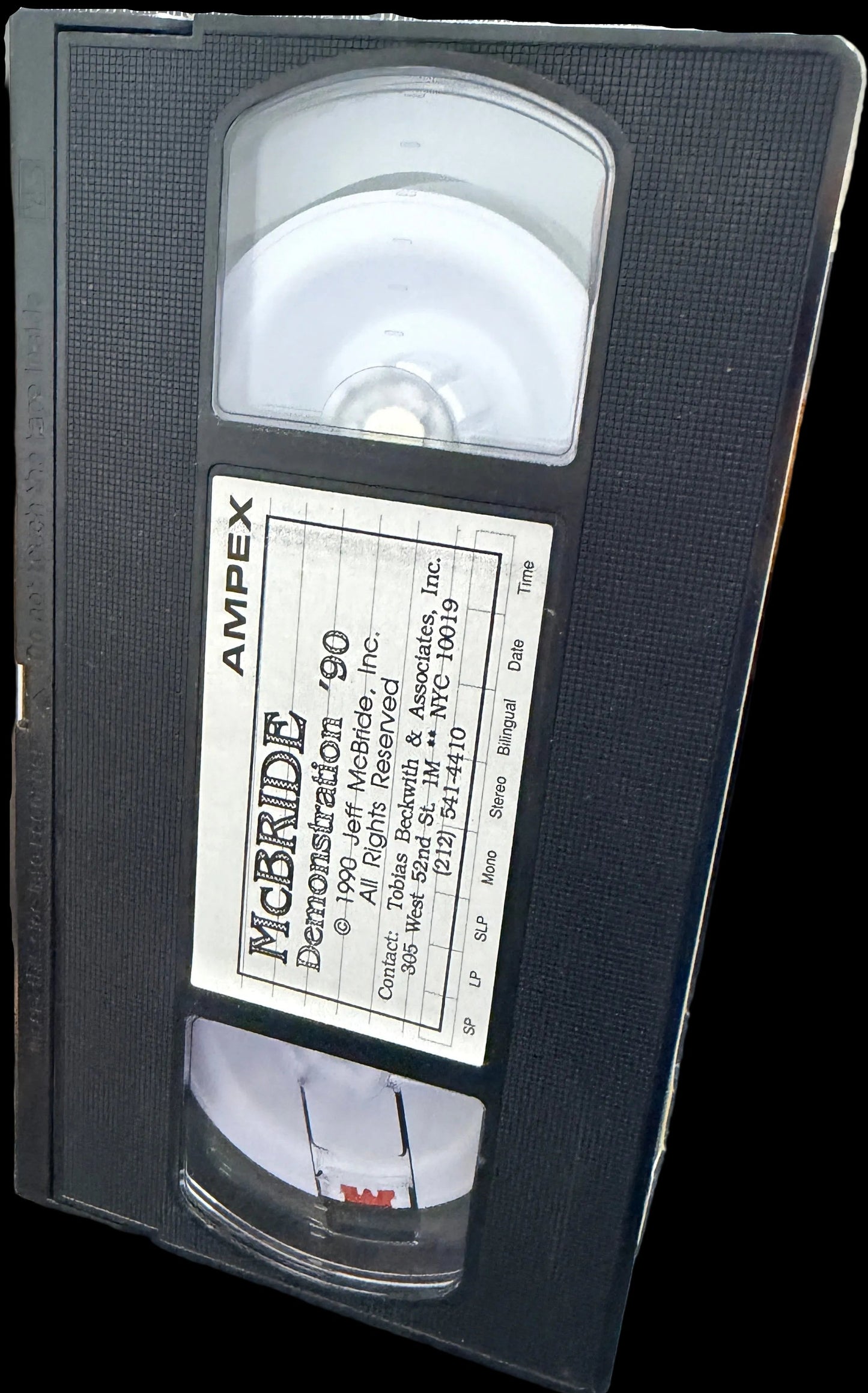 VHS tape with AMPEX branding on a map background