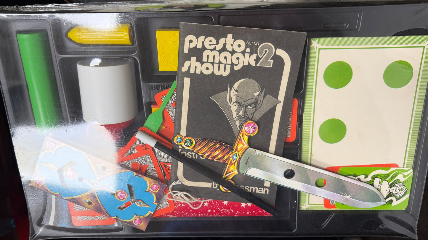 Presto Magic Show 2 set with a knife and other魔术道具 in a clear plastic case.