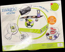 Product packaging labeled 'magic show' inside a black storage bin.
