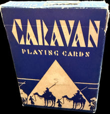 Vintage Marvyn playing cards on a world map