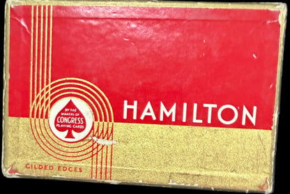 Red and gold Hamilton watch box on a map background