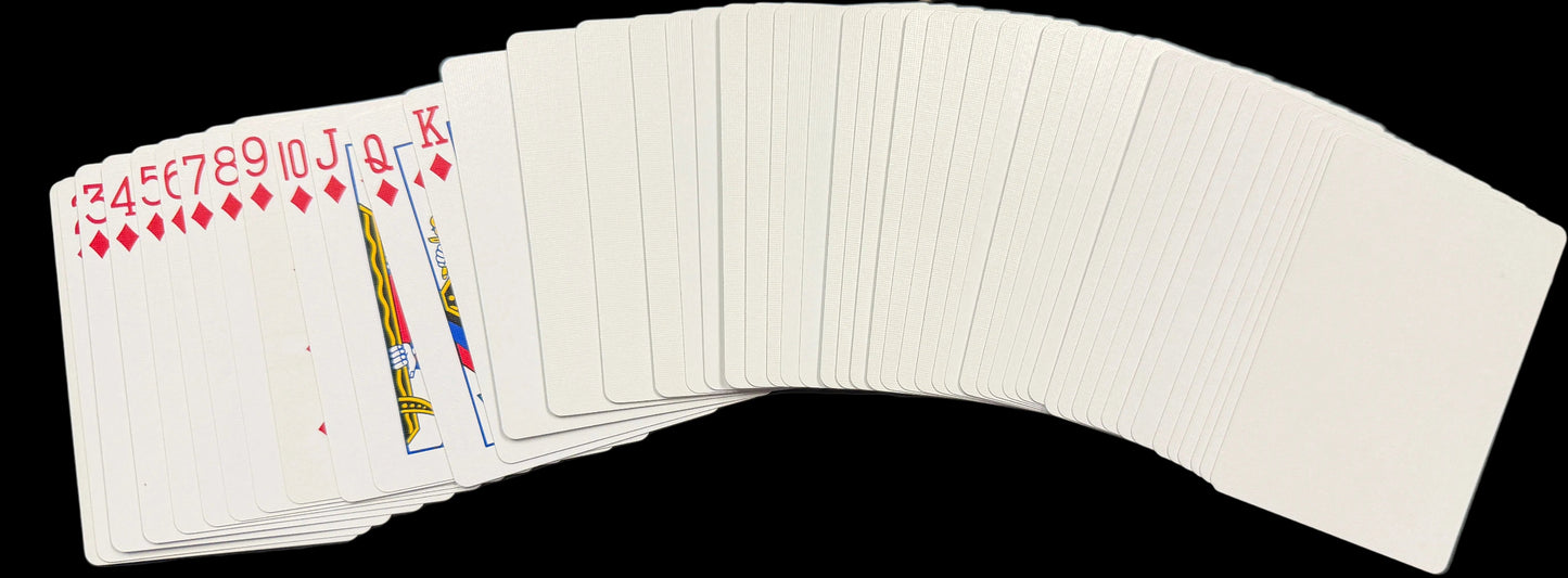 Playing cards on a world map with a keyboard in the background