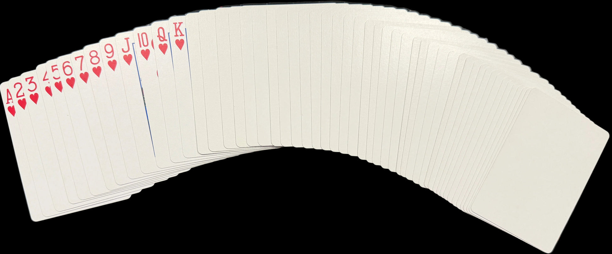 Playing cards on a desk with a keyboard and map