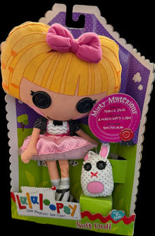 Toy figure in packaging with a pink bow and dress, on a map background.