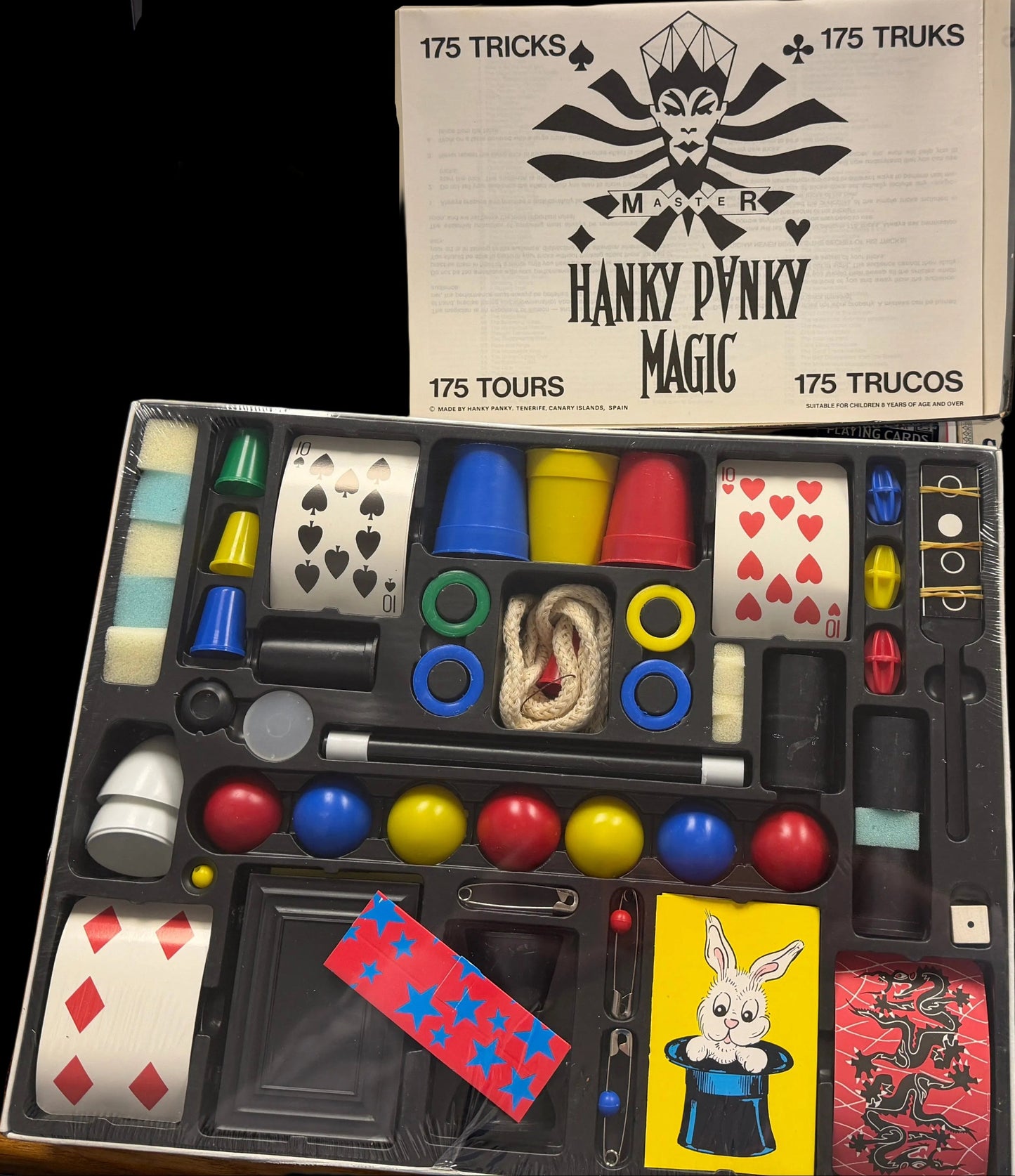 Hanky Dandy Magic kit with various magic props on a desk.