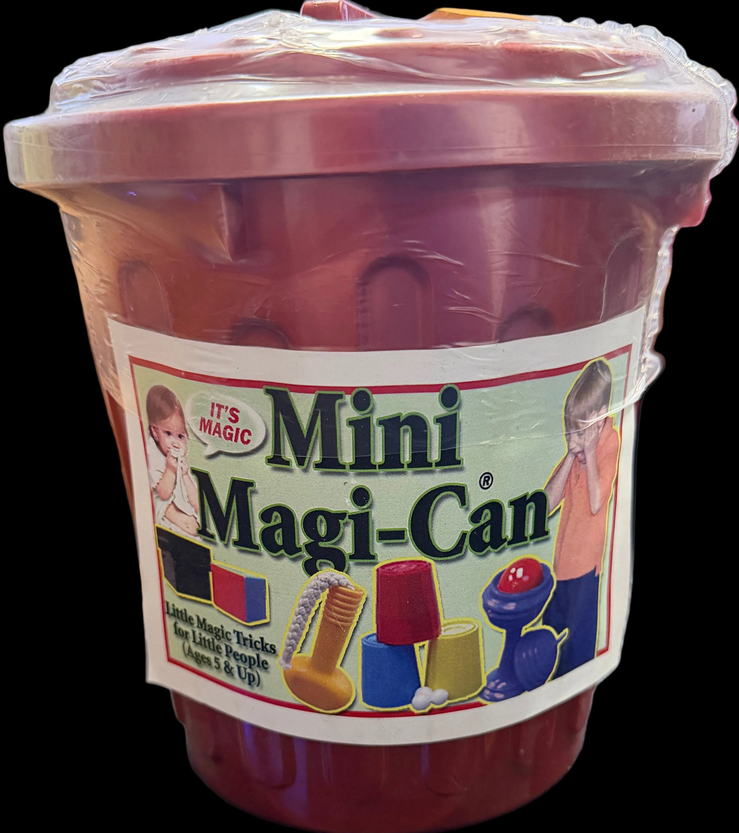 Mini Magi Can container on a desk with a computer screen in the background