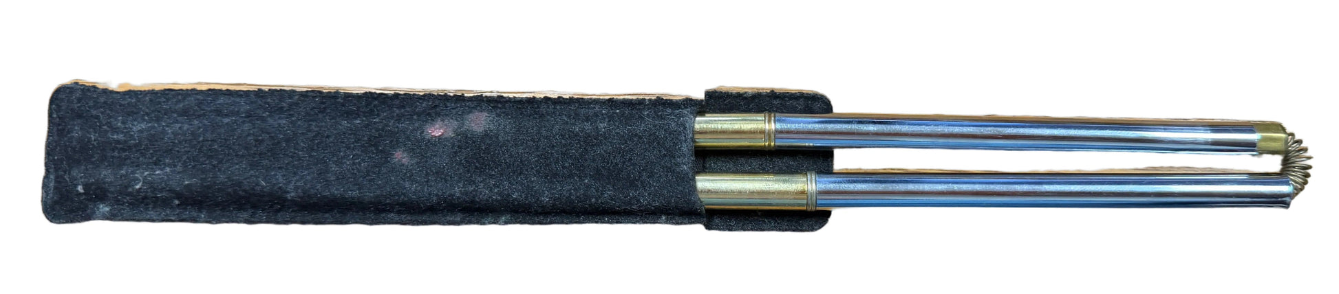 Pen on a wooden desk with a keyboard in the foreground