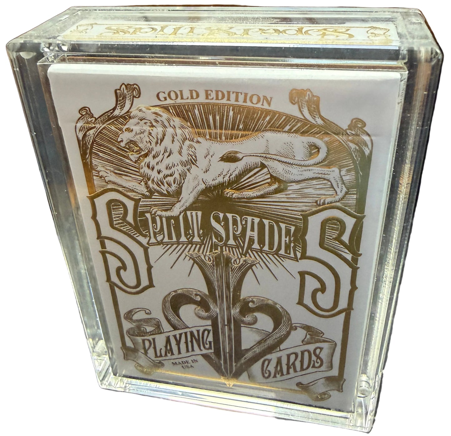 Playing card box with gold and white design on a map background