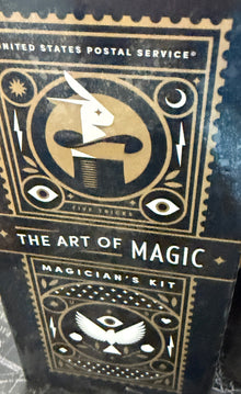 Black and gold card deck packaging with decorative design on a world map background