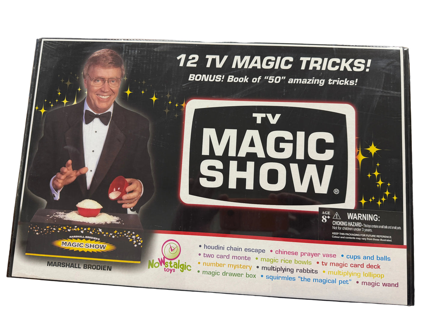 TV Magic Show packaging with a magician on the cover, displayed on a desk.