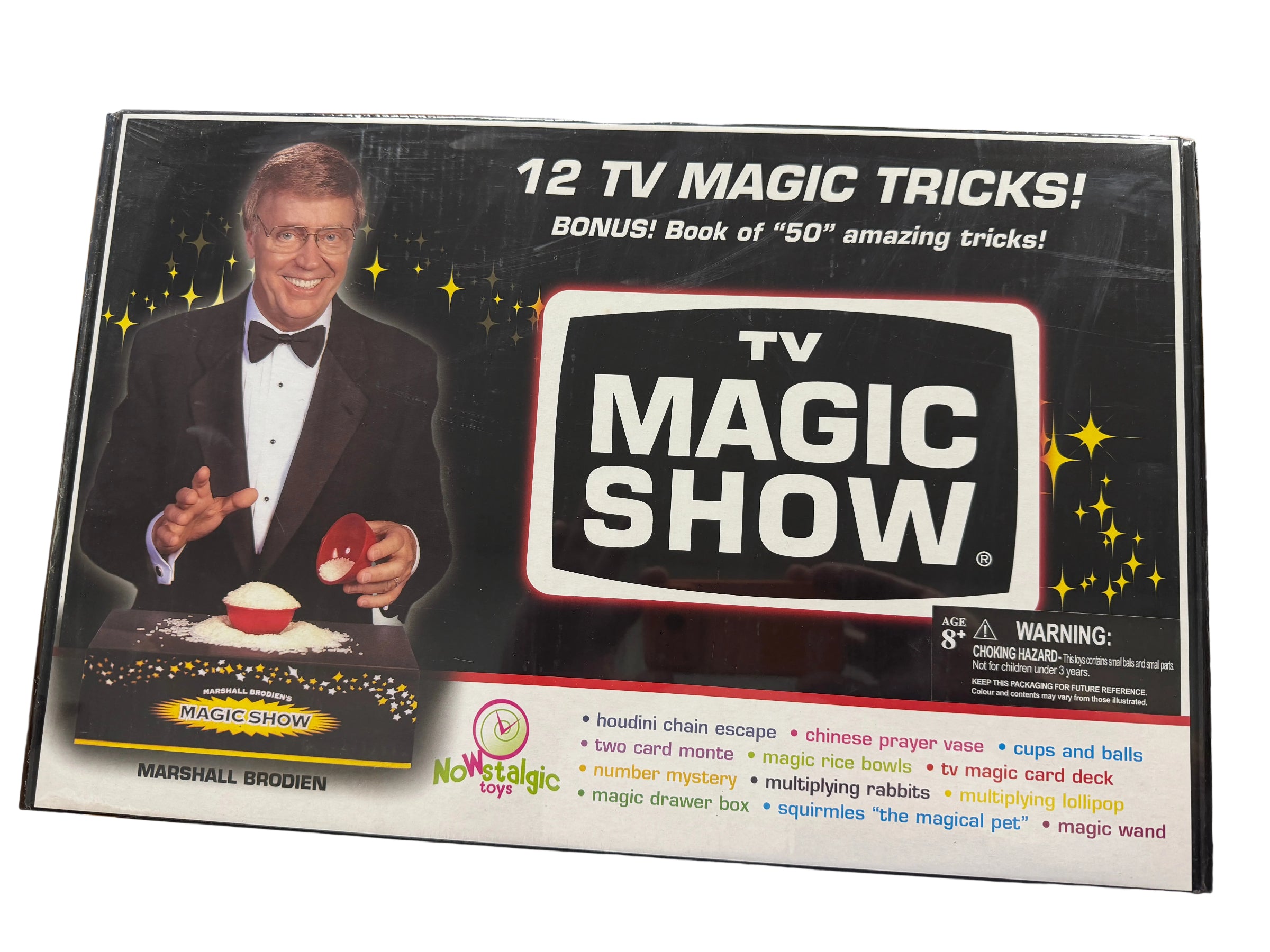 TV Magic Show packaging with a magician on the cover, displayed on a desk.