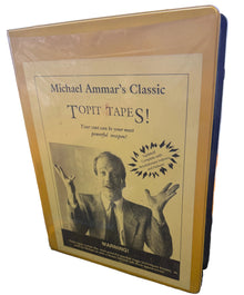 Book titled 'Topit Tapes!' by Michael Ammar on a desk with a blurred background