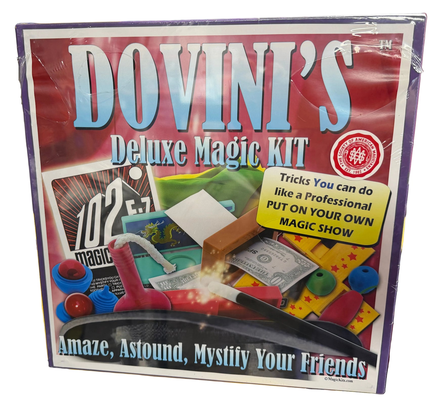Dovini's Deluxe Magic Kit packaging with colorful graphics on a red background