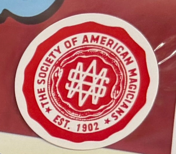 Dovini's Deluxe Magic Kit packaging with colorful graphics on a red background