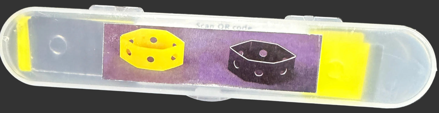 Small rectangular object with purple and yellow design on a map background