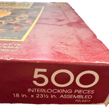 Close-up of a puzzle box with '500 Interlocking Pieces' text on a wooden surface.