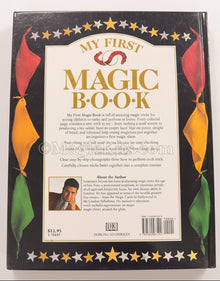 Back cover of 'My First Magic Book' with colorful leaves and text.